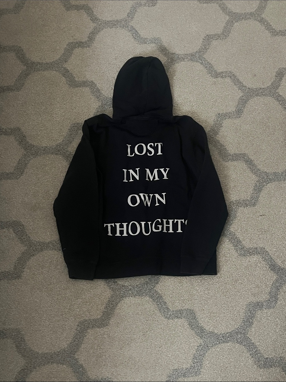 Black Hoodie, “Lost in my own thoughts” on back